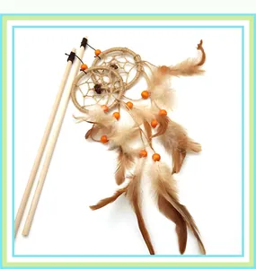 Detailed view of interactive cat wand toy with natural feathers and wooden dreamcatcher