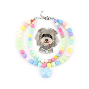 Detailed view of macaron colored bead pet collar with a blue star pendant accessory.