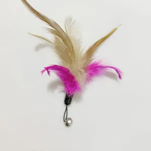 Detail showing pink and khaki feathers of a cat toy wand replacement head with bell.