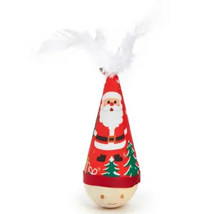 Detailed view of Christmas themed tumbler cat toy with white feathers and wooden base