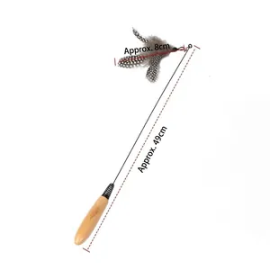 Detailed view showing the length of interactive cat teaser wand with feathers