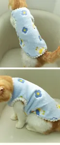 Detail view of a soft blue floral fleece vest for pets, showing the thick warm texture