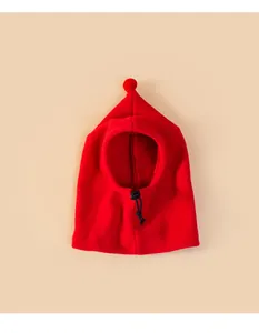 Macro detail of a bright red fleece Christmas pet balaclava hat with adjustable drawstring toggle.