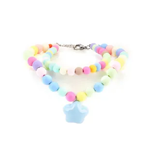 Detailed view of colorful pastel beaded pet collar with a cute light blue star pendant