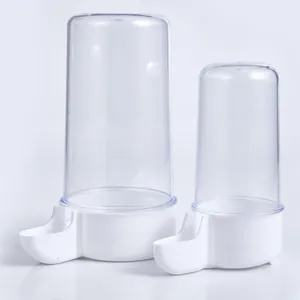 Detail view of automatic bird feeders in two sizes with transparent acrylic tops and white bases