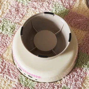 Elevated pet bowl with cartoon pattern and non-slip base for cat neck protection