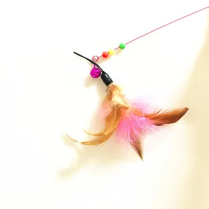 Close-up view of an interactive cat teaser toy featuring pink feathers and a small metal bell