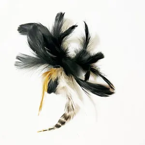 Macro view of natural feather replacement head for cat wand toys with black and white stripes