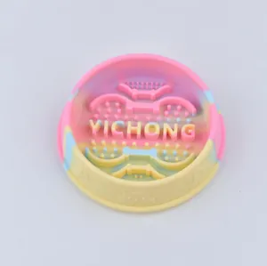 Macro view of the macaron rainbow silicone slow feeder bowl with textured columns
