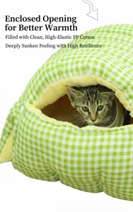 Detail view of a green checkered hooded cat bed showing soft yellow plush lining