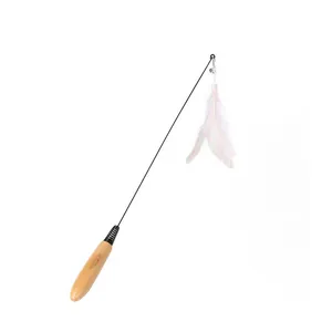 Detailed macro view of cat teaser wand with natural white feathers and wooden handle