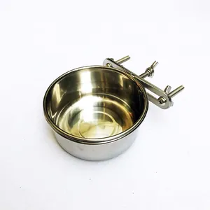 Detail view of a stainless steel hanging pet bowl with cage fixing screws.