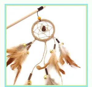 Detailed view of interactive cat teaser wand with feathers, bells and dreamcatcher design