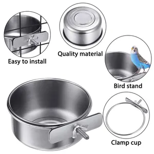 Detailed close-up of stainless steel bird feeding cup with secure cage clamp assembly
