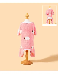 Detail of pink coral fleece dog pajamas with cute white sheep pattern