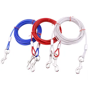 Detailed view of three colorful steel wire pet tie-out cables with dual snap hooks