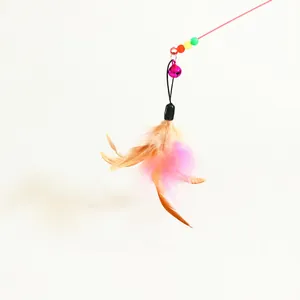 Close-up detail of a colorful feather cat teaser replacement head with a small bell