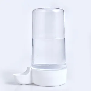 Close-up of automatic bird waterer with transparent reservoir and white base for small poultry