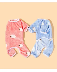 Detailed view of two soft coral fleece dog onesies arranged in a heart shape.
