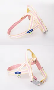 Pink striped dog harness with breathable mesh lining and secure buckle detail