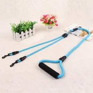 Durable double dog leash in light blue with comfortable black foam handle for two pets