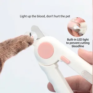 Detail view of pet nail clipper with LED light illuminating bloodline for safe grooming.