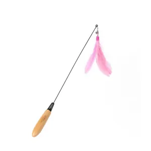 Detail of cat teaser wand featuring a natural wooden handle and soft pink feathers