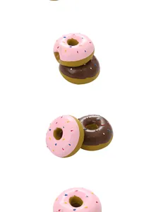 Detail view of colorful latex donut-shaped squeaky dog toys for teeth cleaning and play