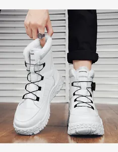 Close-up of white outdoor snow boots with warm faux fur lining and quick lacing system