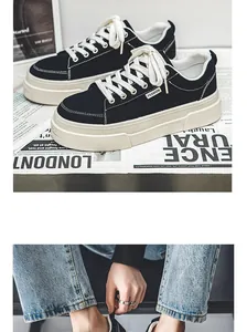 Close-up of black canvas platform sneakers featuring thick white soles and cream laces