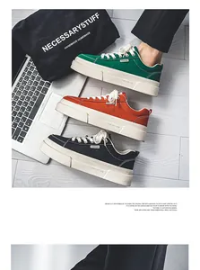 Detailed side view showing green, orange, and black thick-soled canvas sneakers