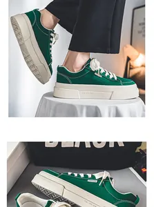 Side detail of green canvas thick-soled casual sneakers with white stitching and laces