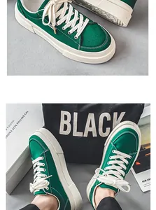 Detailed view of green canvas men's sneakers featuring thick soles and cream laces