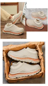 Close-up of winter plush cotton slippers with thick sole and knit sock collar