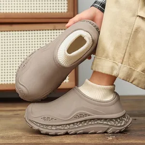 Comfortable winter clog slippers featuring thick soles and warm knitted sock cuffs in taupe