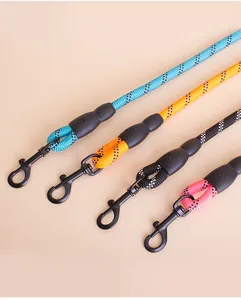 Close-up of four colorful reflective dog leashes with durable black metal clip ends