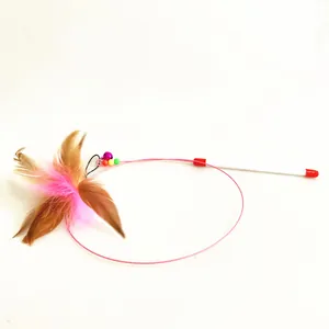 Detailed view of the steel wire cat teaser toy with feathers and bell