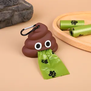 Detail view of poop emoji shaped pet waste bag dispenser with a metal carabiner