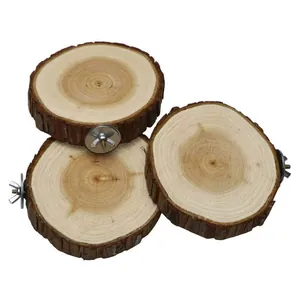 Close-up view of three natural wood bird perches with metal mounting wing nuts for cages