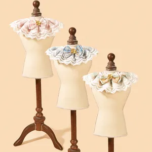 Cute lace pet collar with plaid bow bib for cats and small dogs on display mannequins