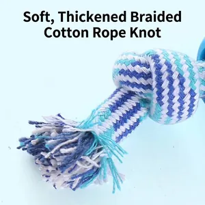 Macro view of durable braided cotton rope dog toy for chewing and teeth cleaning.