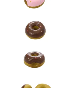 Vertical macro view of chocolate and pink latex donut squeaky dog toys with sprinkles.