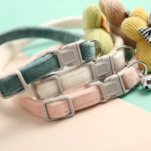 Close-up detail of soft velvet pet collars with adjustable buckles and cute rabbit decor