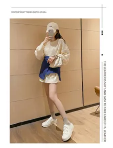 Full-body outfit featuring stylish white canvas sports shoes with a casual cream knit