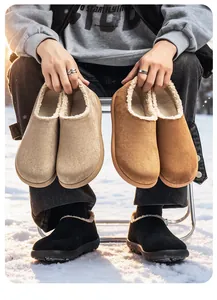 Detail of plush-lined suede loafers in beige, brown and black shown in outdoor snow