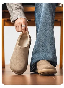 Close-up of khaki suede Birkenstock style slip-on with warm plush fleece lining