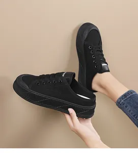 Comfortable black canvas platform mule sneakers for women featuring a slip-on backless design