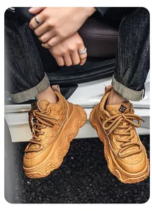 Close-up of tan high-top platform sneakers with quilted faux leather design