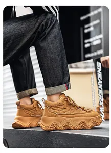 Close-up of tan high-top warm leather sneakers with thick wavy soles.
