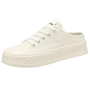 Off-white women's canvas mule sneakers featuring thick textured soles and lace-up design